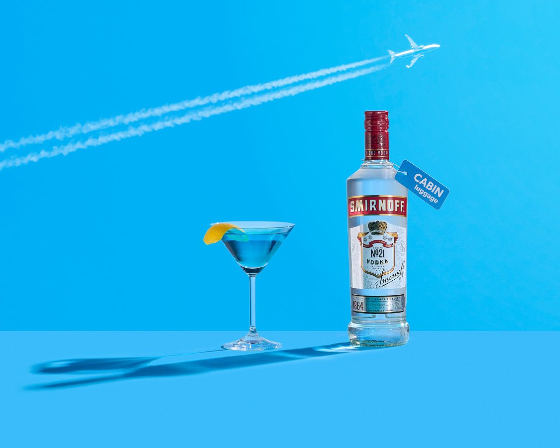 Smirnoff vodka cocktail in Pan Am airline theme focused