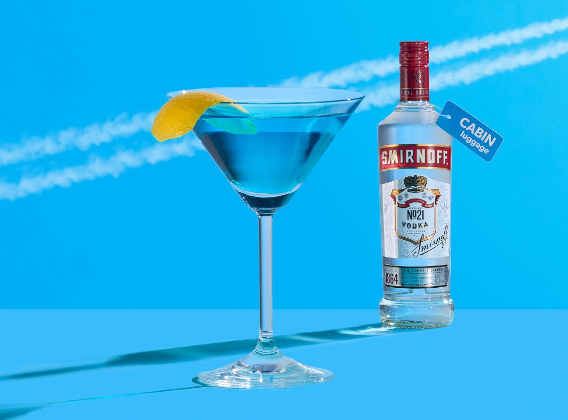 Smirnoff vodka cocktail in Pan Am airline theme focused