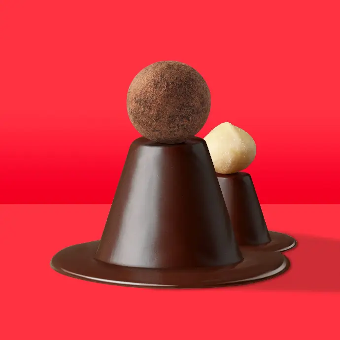 Brown Macolat chocolate ball on a dark chocolate cone on a red background